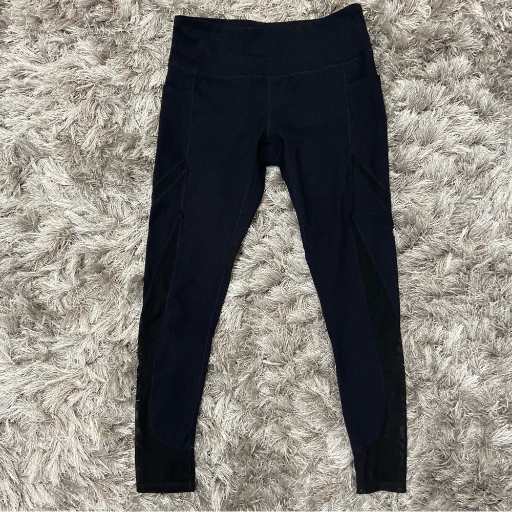Along Fit women black mesh design, side pockets workout leggings. Size L. Used.